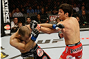 SAN JOSE, CA - APRIL 20:   (R-L) Joseph Benavidez punches Darren Uyenoyama in their flyweight bout during the UFC on FOX event at the HP Pavilion on April 20, 2013 in San Jose, California.  (Photo by Ezra Shaw/Zuffa LLC/Zuffa LLC via Getty Images)  *** Local Caption *** Joseph Benavidez; Darren Uyenoyama