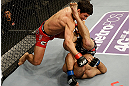 SAN JOSE, CA - APRIL 20:   Joseph Benavidez (top) punches Darren Uyenoyama in their flyweight bout during the UFC on FOX event at the HP Pavilion on April 20, 2013 in San Jose, California.  (Photo by Ezra Shaw/Zuffa LLC/Zuffa LLC via Getty Images)  *** Local Caption *** Joseph Benavidez; Darren Uyenoyama