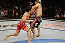 SAN JOSE, CA - APRIL 20:   (L-R) Joseph Benavidez punches Darren Uyenoyama in their flyweight bout during the UFC on FOX event at the HP Pavilion on April 20, 2013 in San Jose, California.  (Photo by Ezra Shaw/Zuffa LLC/Zuffa LLC via Getty Images)  *** Local Caption *** Joseph Benavidez; Darren Uyenoyama