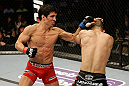 SAN JOSE, CA - APRIL 20:   (L-R) Joseph Benavidez punches Darren Uyenoyama in their flyweight bout during the UFC on FOX event at the HP Pavilion on April 20, 2013 in San Jose, California.  (Photo by Ezra Shaw/Zuffa LLC/Zuffa LLC via Getty Images)  *** Local Caption *** Joseph Benavidez; Darren Uyenoyama