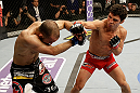 SAN JOSE, CA - APRIL 20:   (R-L) Joseph Benavidez punches Darren Uyenoyama in their flyweight bout during the UFC on FOX event at the HP Pavilion on April 20, 2013 in San Jose, California.  (Photo by Ezra Shaw/Zuffa LLC/Zuffa LLC via Getty Images)  *** Local Caption *** Joseph Benavidez; Darren Uyenoyama
