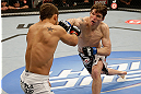 SAN JOSE, CA - APRIL 20:   (R-L) Darren Elkins punches Chad Mendes in their featherweight bout during the UFC on FOX event at the HP Pavilion on April 20, 2013 in San Jose, California.  (Photo by Ezra Shaw/Zuffa LLC/Zuffa LLC via Getty Images)  *** Local Caption *** Chad Mendes; Darren Elkins