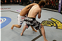 SAN JOSE, CA - APRIL 20:   (L-R) Chad Mendes punches Darren Elkins in their featherweight bout during the UFC on FOX event at the HP Pavilion on April 20, 2013 in San Jose, California.  (Photo by Ezra Shaw/Zuffa LLC/Zuffa LLC via Getty Images)  *** Local Caption *** Chad Mendes; Darren Elkins