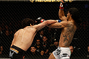 SAN JOSE, CA - APRIL 20:   (L-R) Gilbert Melendez punches Benson Henderson in their lightweight championship bout during the UFC on FOX event at the HP Pavilion on April 20, 2013 in San Jose, California.  (Photo by Ezra Shaw/Zuffa LLC/Zuffa LLC via Getty Images)  *** Local Caption *** Benson Henderson; Gilbert Melendez