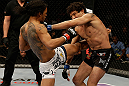 SAN JOSE, CA - APRIL 20:   (L-R) Benson Henderson knees Gilbert Melendez in their lightweight championship bout during the UFC on FOX event at the HP Pavilion on April 20, 2013 in San Jose, California.  (Photo by Ezra Shaw/Zuffa LLC/Zuffa LLC via Getty Images)  *** Local Caption *** Benson Henderson; Gilbert Melendez