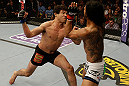 SAN JOSE, CA - APRIL 20:   (L-R) Gilbert Melendez punches Benson Henderson in their lightweight championship bout during the UFC on FOX event at the HP Pavilion on April 20, 2013 in San Jose, California.  (Photo by Ezra Shaw/Zuffa LLC/Zuffa LLC via Getty Images)  *** Local Caption *** Benson Henderson; Gilbert Melendez