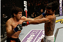SAN JOSE, CA - APRIL 20:   (L-R) Gilbert Melendez punches Benson Henderson in their lightweight championship bout during the UFC on FOX event at the HP Pavilion on April 20, 2013 in San Jose, California.  (Photo by Ezra Shaw/Zuffa LLC/Zuffa LLC via Getty Images)  *** Local Caption *** Benson Henderson; Gilbert Melendez