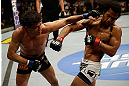 SAN JOSE, CA - APRIL 20:   (L-R) Gilbert Melendez punches Benson Henderson in their lightweight championship bout during the UFC on FOX event at the HP Pavilion on April 20, 2013 in San Jose, California.  (Photo by Ezra Shaw/Zuffa LLC/Zuffa LLC via Getty Images)  *** Local Caption *** Benson Henderson; Gilbert Melendez