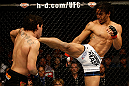 SAN JOSE, CA - APRIL 20:   (R-L) Benson Henderson kicks Gilbert Melendez in their lightweight championship bout during the UFC on FOX event at the HP Pavilion on April 20, 2013 in San Jose, California.  (Photo by Ezra Shaw/Zuffa LLC/Zuffa LLC via Getty Images)  *** Local Caption *** Benson Henderson; Gilbert Melendez