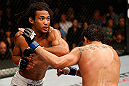 SAN JOSE, CA - APRIL 20:   (L-R) Benson Henderson punches Gilbert Melendez in their lightweight championship bout during the UFC on FOX event during the UFC on FOX event at the HP Pavilion on April 20, 2013 in San Jose, California.  (Photo by Josh Hedges/Zuffa LLC/Zuffa LLC via Getty Images)  *** Local Caption *** Benson Henderson; Gilbert Melendez