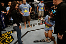 SAN JOSE, CA - APRIL 20:   Benson Henderson (right) proposes to his girlfirend Maria Magana (left) during the UFC on FOX event at the HP Pavilion on April 20, 2013 in San Jose, California.  (Photo by Ezra Shaw/Zuffa LLC/Zuffa LLC via Getty Images)  *** Local Caption *** Benson Henderson; Maria Magana