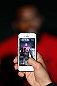 NEW YORK, NY - APRIL 25:   UFC Light Heavyweight Champion Jon "Bones" Jones is seen on an iPhone screen as he interacts with media during UFC 159 media day at The Theater at Madison Square Garden on April 25, 2013 in New York City.  (Photo by Josh Hedges/Zuffa LLC/Zuffa LLC via Getty Images)