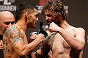 NEWARK, NJ - APRIL 26:   (L-R) Opponents Leonard Garcia and Cody McKenzie face off during the UFC 159 weigh-in event at the Prudential Center on April 26, 2013 in Newark, New Jersey.  (Photo by Josh Hedges/Zuffa LLC/Zuffa LLC via Getty Images)