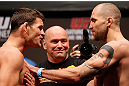 NEWARK, NJ - APRIL 26:   (L-R) Opponents Michael Bisping and Alan Belcher face off during the UFC 159 weigh-in event at the Prudential Center on April 26, 2013 in Newark, New Jersey.  (Photo by Josh Hedges/Zuffa LLC/Zuffa LLC via Getty Images)