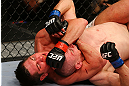 NEWARK, NJ - APRIL 27:  Steven Siler chokes Kurt Holobaugh in their featherweight bout during the UFC 159 event at the Prudential Center on April 27, 2013 in Newark, New Jersey.  (Photo by Al Bello/Zuffa LLC/Zuffa LLC Via Getty Images)