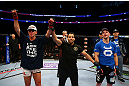 NEWARK, NJ - APRIL 27:  Steven Siler (L) is announced winner by unanimous decision in his featherweight bout against Kurt Holobaugh (R) during the UFC 159 event at the Prudential Center on April 27, 2013 in Newark, New Jersey.  (Photo by Al Bello/Zuffa LLC/Zuffa LLC Via Getty Images)