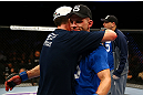 NEWARK, NJ - APRIL 27:  Steven Siler (L) is hugs opponent Kurt Holobaugh (R) after winning their featherweight bout by unanimous decision during the UFC 159 event at the Prudential Center on April 27, 2013 in Newark, New Jersey.  (Photo by Al Bello/Zuffa LLC/Zuffa LLC Via Getty Images)