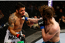 NEWARK, NJ - APRIL 27:  Cody McKenzie (R) punches Leonard Garcia (L) in their featherweight bout during the UFC 159 event at the Prudential Center on April 27, 2013 in Newark, New Jersey.  (Photo by Al Bello/Zuffa LLC/Zuffa LLC Via Getty Images)