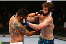 NEWARK, NJ - APRIL 27: (L-R) Leonard Garcia and Cody McKenzie exchange punches in their featherweight bout during the UFC 159 event at the Prudential Center on April 27, 2013 in Newark, New Jersey.  (Photo by Al Bello/Zuffa LLC/Zuffa LLC Via Getty Images)