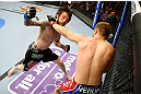 NEWARK, NJ - APRIL 27: (L-R) Johnny Bedford and Bryan Caraway exchange punches in their bantamweight bout during the UFC 159 event at the Prudential Center on April 27, 2013 in Newark, New Jersey.  (Photo by Al Bello/Zuffa LLC/Zuffa LLC Via Getty Images)