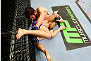 NEWARK, NJ - APRIL 27:  Bryan Caraway (R) battles against Johnny Bedford (L) in their bantamweight bout during the UFC 159 event at the Prudential Center on April 27, 2013 in Newark, New Jersey.  (Photo by Al Bello/Zuffa LLC/Zuffa LLC Via Getty Images)