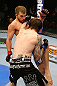 NEWARK, NJ - APRIL 27:  Johnny Bedford (R) throws a punch against Bryan Caraway (L) in their bantamweight bout during the UFC 159 event at the Prudential Center on April 27, 2013 in Newark, New Jersey.  (Photo by Al Bello/Zuffa LLC/Zuffa LLC Via Getty Images)