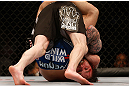 NEWARK, NJ - APRIL 27:   Johny Bedford is defeated by Bryan Caraway by submission due to a guillotine choke in their bantamweight fight during the UFC 159 event at the Prudential Center on April 27, 2013 in Newark, New Jersey.  (Photo by Josh Hedges/Zuffa LLC/Zuffa LLC via Getty Images)