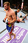 NEWARK, NJ - APRIL 27:  Bryan Caraway (L) celebrates winning by submission (guillotine choke) against Johnny Bedford (R) in their bantamweight bout during the UFC 159 event at the Prudential Center on April 27, 2013 in Newark, New Jersey.  (Photo by Al Bello/Zuffa LLC/Zuffa LLC Via Getty Images)