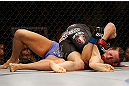NEWARK, NJ - APRIL 27:   Sara McMann (top) punches Sheila Gaff in their bantamweight fight during the UFC 159 event at the Prudential Center on April 27, 2013 in Newark, New Jersey.  (Photo by Josh Hedges/Zuffa LLC/Zuffa LLC via Getty Images)