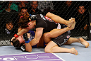 NEWARK, NJ - APRIL 27: Sara McMann (top) battles against Sheila Gaff (bottom) in round one of their women's bantamweight bout during the UFC 159 event at the Prudential Center on April 27, 2013 in Newark, New Jersey.  (Photo by Al Bello/Zuffa LLC/Zuffa LLC Via Getty Images)