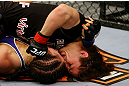NEWARK, NJ - APRIL 27: Sara McMann punches Sheila Gaff in round one of their women's bantamweight bout during the UFC 159 event at the Prudential Center on April 27, 2013 in Newark, New Jersey.  (Photo by Al Bello/Zuffa LLC/Zuffa LLC Via Getty Images)