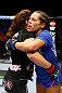 NEWARK, NJ - APRIL 27: Sheila Gaff (R)congratulates Sara McMann (L) on her win by KO/TKO in round one of their women's bantamweight bout during the UFC 159 event at the Prudential Center on April 27, 2013 in Newark, New Jersey.  (Photo by Al Bello/Zuffa LLC/Zuffa LLC Via Getty Images)