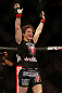 NEWARK, NJ - APRIL 27:   Sara McMann reacts after defeating Sheila Gaff in their bantamweight fight during the UFC 159 event at the Prudential Center on April 27, 2013 in Newark, New Jersey.  (Photo by Josh Hedges/Zuffa LLC/Zuffa LLC via Getty Images)
