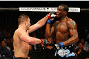 NEWARK, NJ - APRIL 27: (L-R) Gian Villante throws a punch against Ovince Saint Preux in their light heavyweight bout during the UFC 159 event at the Prudential Center on April 27, 2013 in Newark, New Jersey.  (Photo by Al Bello/Zuffa LLC/Zuffa LLC Via Getty Images)