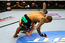 NEWARK, NJ - APRIL 27:  Rustam Khabilov (bottom) of Russia takes down Yancy Medeiros (top) in their lightweight bout during the UFC 159 event at the Prudential Center on April 27, 2013 in Newark, New Jersey.  (Photo by Al Bello/Zuffa LLC/Zuffa LLC Via Getty Images)
