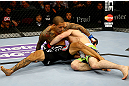NEWARK, NJ - APRIL 27: Yancy Medeiros (L) struggles against Rustam Khabilov (R) of Russia in their lightweight bout during the UFC 159 event at the Prudential Center on April 27, 2013 in Newark, New Jersey.  (Photo by Al Bello/Zuffa LLC/Zuffa LLC Via Getty Images)