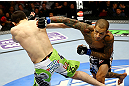 NEWARK, NJ - APRIL 27:  Yancy Medeiros (R) throws a punch against Rustam Khabilov (L) of Russia in their lightweight bout during the UFC 159 event at the Prudential Center on April 27, 2013 in Newark, New Jersey.  (Photo by Al Bello/Zuffa LLC/Zuffa LLC Via Getty Images)