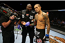 NEWARK, NJ - APRIL 27: Yancy Medeiros has his injured hand evaluated during his lightweight bout against Rustam Khabilov of Russia during the UFC 159 event at the Prudential Center on April 27, 2013 in Newark, New Jersey.  (Photo by Al Bello/Zuffa LLC/Zuffa LLC Via Getty Images)