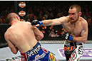 NEWARK, NJ - APRIL 27:  Pat Healy (R) throws a punch against Jim Miller (L) in their lightweight bout during the UFC 159 event at the Prudential Center on April 27, 2013 in Newark, New Jersey.  (Photo by Al Bello/Zuffa LLC/Zuffa LLC Via Getty Images)
