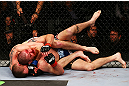 NEWARK, NJ - APRIL 27: Pat Healy performs a rear-naked choke against Jim Miller in the third round of their lightweight bout during the UFC 159 event at the Prudential Center on April 27, 2013 in Newark, New Jersey.  (Photo by Al Bello/Zuffa LLC/Zuffa LLC Via Getty Images)