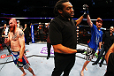 NEWARK, NJ - APRIL 27:  Referee Herb Dean (C) raises the arm of winner Pat Healy (R) after defeating Jim Miller (L) by Technical Submission (rear-naked choke) in their lightweight bout during the UFC 159 event at the Prudential Center on April 27, 2013 in Newark, New Jersey.  (Photo by Al Bello/Zuffa LLC/Zuffa LLC Via Getty Images)