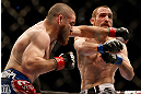 NEWARK, NJ - APRIL 27:   (L-R) Jim Miller punches Pat Healy in their lightweight fight during the UFC 159 event at the Prudential Center on April 27, 2013 in Newark, New Jersey.  (Photo by Josh Hedges/Zuffa LLC/Zuffa LLC via Getty Images)