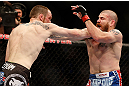 NEWARK, NJ - APRIL 27:   (L-R) Pat Healy punches Jim Miller in their lightweight fight during the UFC 159 event at the Prudential Center on April 27, 2013 in Newark, New Jersey.  (Photo by Josh Hedges/Zuffa LLC/Zuffa LLC via Getty Images)