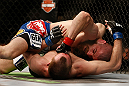 NEWARK, NJ - APRIL 27:   Jim Miller (top) punches Pat Healy in their lightweight fight during the UFC 159 event at the Prudential Center on April 27, 2013 in Newark, New Jersey.  (Photo by Josh Hedges/Zuffa LLC/Zuffa LLC via Getty Images)