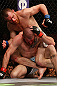 NEWARK, NJ - APRIL 27:   Pat Healy (top) punches Jim Miller in their lightweight fight during the UFC 159 event at the Prudential Center on April 27, 2013 in Newark, New Jersey.  (Photo by Josh Hedges/Zuffa LLC/Zuffa LLC via Getty Images)