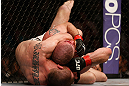 NEWARK, NJ - APRIL 27:   (L-R) Pat Healy secures a rear choke submission against Jim Miller in their lightweight fight during the UFC 159 event at the Prudential Center on April 27, 2013 in Newark, New Jersey.  (Photo by Josh Hedges/Zuffa LLC/Zuffa LLC via Getty Images)