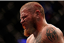 NEWARK, NJ - APRIL 27:   A dejected Jim Miller leaves the Octagon after his loss to Pat Healy in their lightweight fight during the UFC 159 event at the Prudential Center on April 27, 2013 in Newark, New Jersey.  (Photo by Josh Hedges/Zuffa LLC/Zuffa LLC via Getty Images)