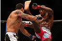 NEWARK, NJ - APRIL 27:   (R-L) Phil Davis kicks Vinny Magalhaes in their light heavyweight fight during the UFC 159 event at the Prudential Center on April 27, 2013 in Newark, New Jersey.  (Photo by Josh Hedges/Zuffa LLC/Zuffa LLC via Getty Images)