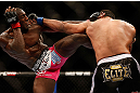 NEWARK, NJ - APRIL 27:   (L-R) Phil Davis and Vinny Magalhaes trade strikes in their light heavyweight fight during the UFC 159 event at the Prudential Center on April 27, 2013 in Newark, New Jersey.  (Photo by Josh Hedges/Zuffa LLC/Zuffa LLC via Getty Images)