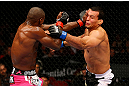 NEWARK, NJ - APRIL 27: Phil Davis throws a punch against Vinny Magalhaes in their light heavyweight bout during the UFC 159 event at the Prudential Center on April 27, 2013 in Newark, New Jersey.  (Photo by Al Bello/Zuffa LLC/Zuffa LLC Via Getty Images)